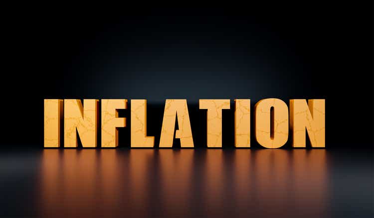 The word Inflation three dimensional in yellow. Surface in concrete and cracked, in yellow, reföection on the floor. The background in black.