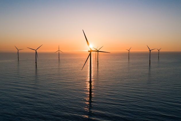 Offshore wind turbines at sunrise seen from an aerial point of view, Redcar, England, United Kingdom