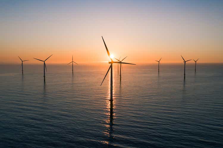 Offshore wind turbines at sunrise seen from an aerial point of view, Redcar, England, United Kingdom