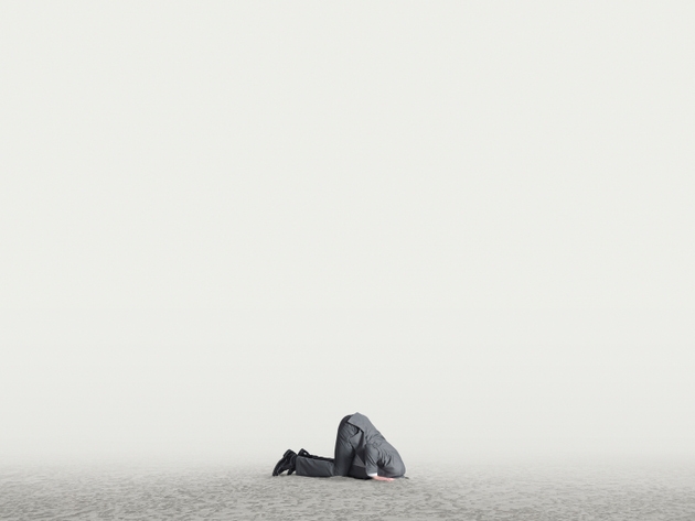Man With Head Buried In The Sand