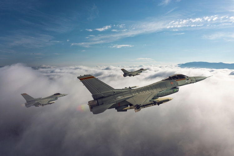 Jet fighters flying over the clouds.