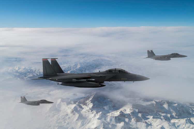 Jet fighters flying over the clouds.