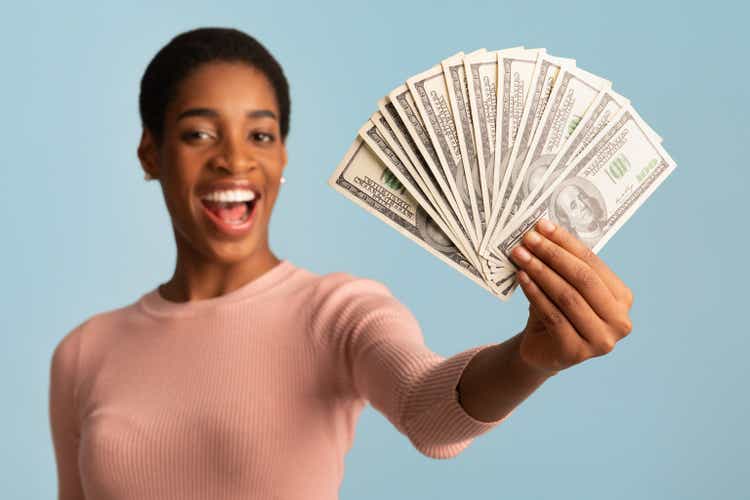 Big Prize. Happy Young African Woman Demonstrating Dollar Cash Fan At Camera