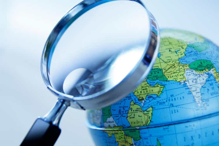 Magnifying Glass And Globe