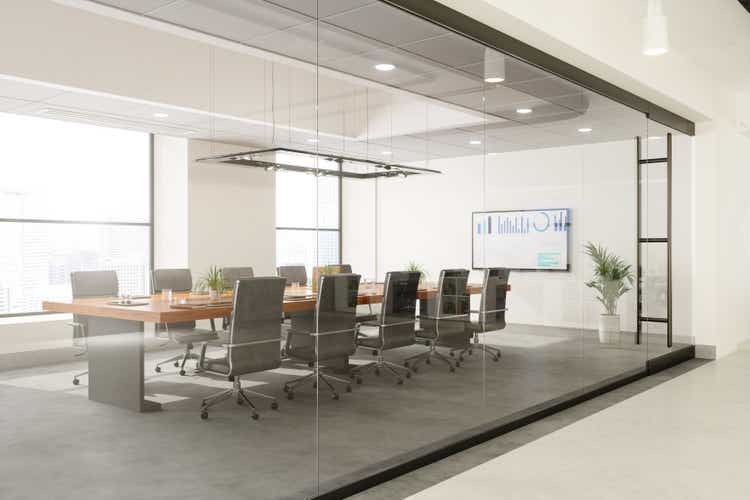 Outside View Of Empty Meeting Room With Table And Office Chairs