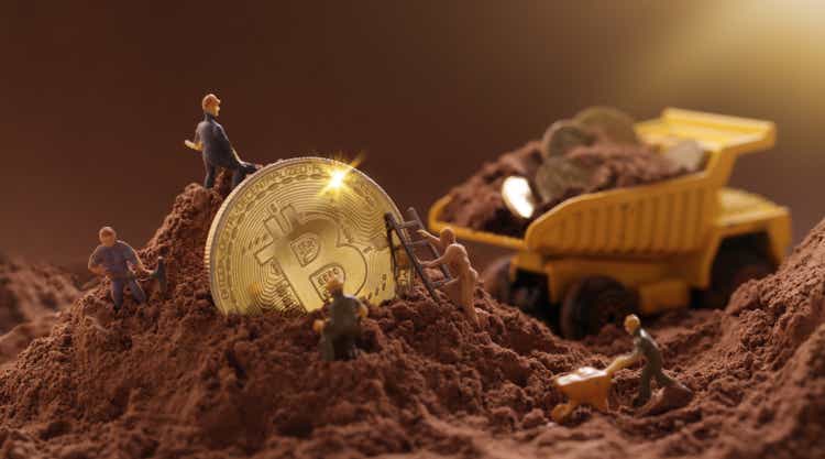 Miner digging ground to uncover big Gold bitcoin. Cryptocurrency Mining concept