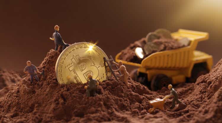 Miner digs ground to uncover large gold bitcoin.  Cryptocurrency mining concept