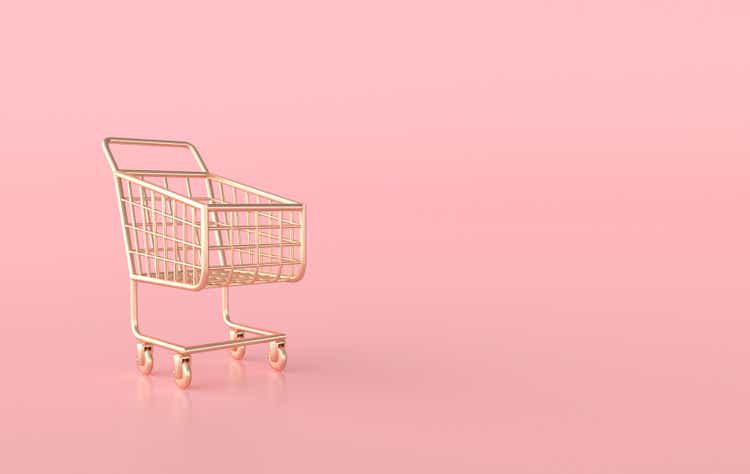 Golden shopping cart on pink background 3d render