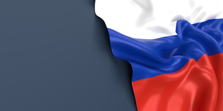 Russian Flag is Waving Against Blue Gray Surface