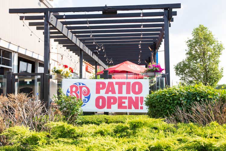 A sign at Boston Pizza restaurant and sports bar says patio open. All businesses are opening in Ontario after a long period of pandemic shutdowns.