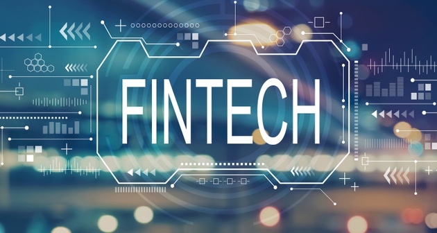 Fintech concept with blurred city lights