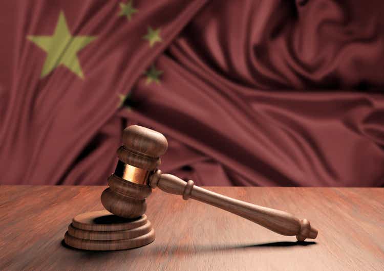 Wooden judge"s gavel Symbol of law and justice with the flag of China. Supreme Court