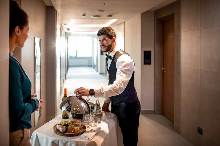 Waiter doing room service