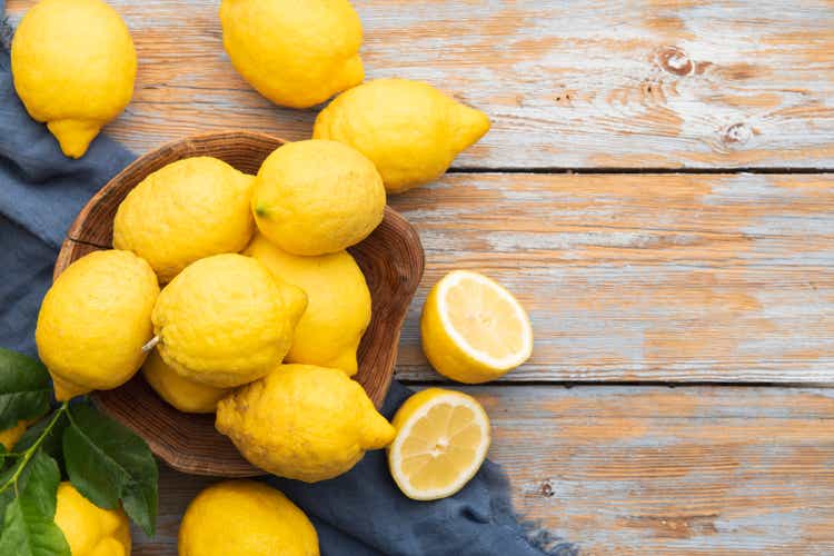 Group of fresh lemon on an old vintage wooden table