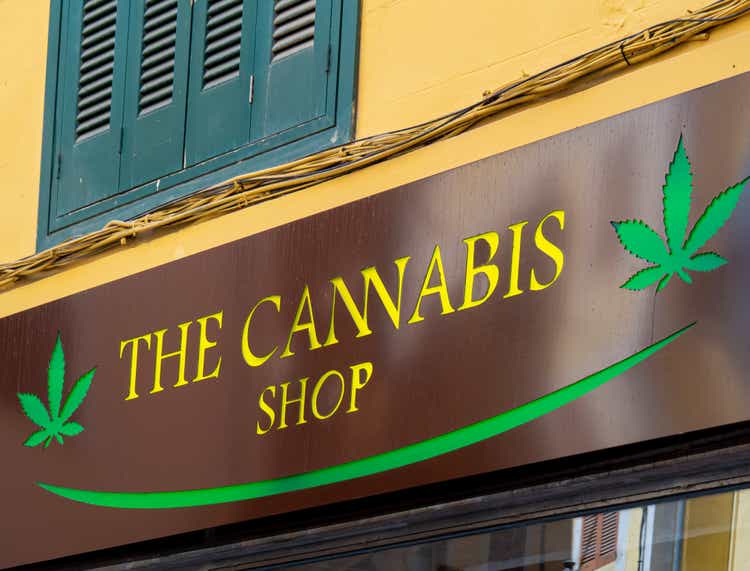 Cannabis shop logo and sign on Cannabis store in a city.