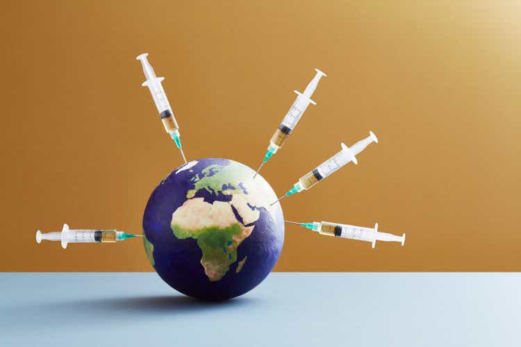 A world globe being vaccinated