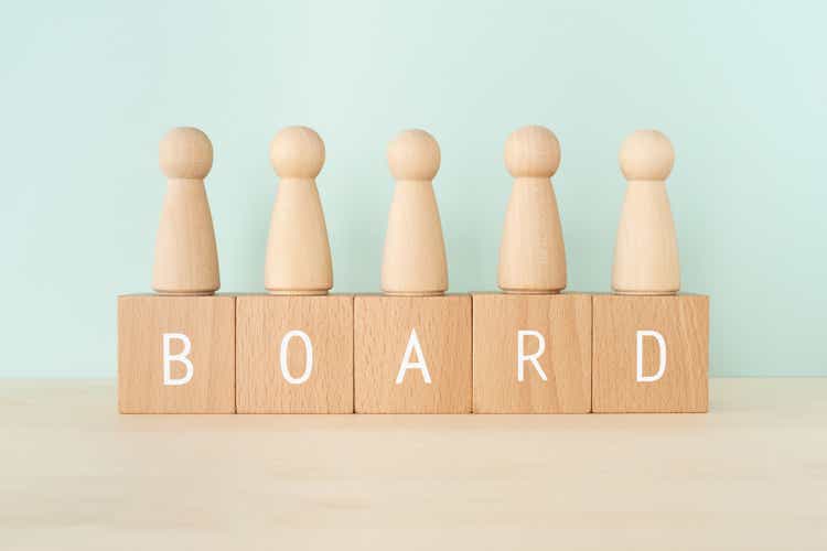 BOARD; Wooden blocks with "BOARD" text of concept and human toys.