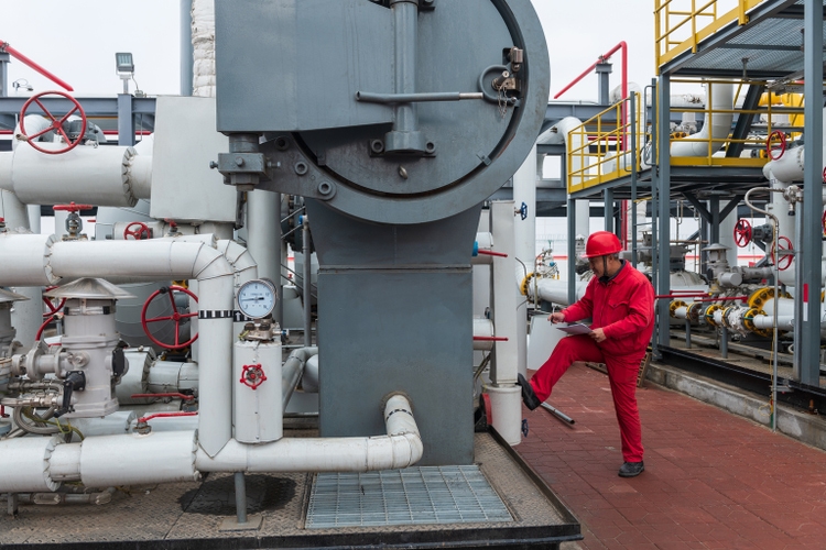 The chemical plant staff are checking the equipment