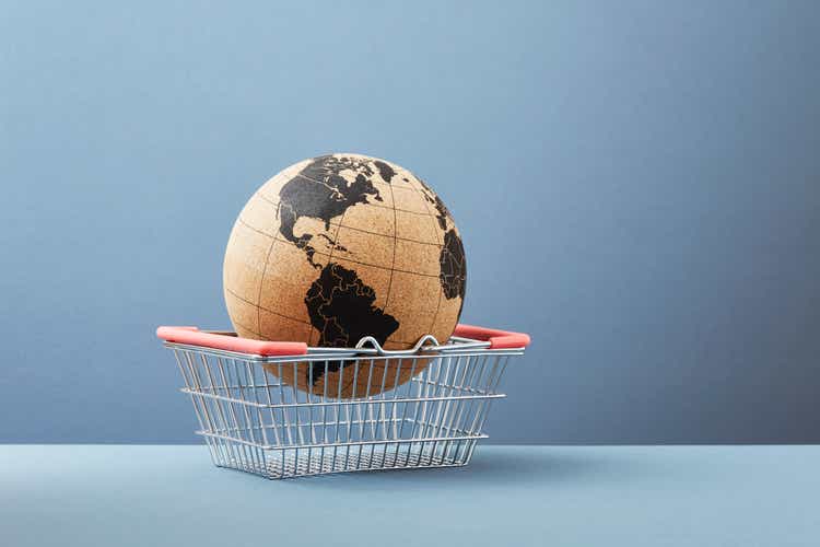 A world globe in a shopping basket
