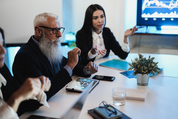 Business trader team doing blockchain analysis inside hedge fund office - Main focus on woman left hand