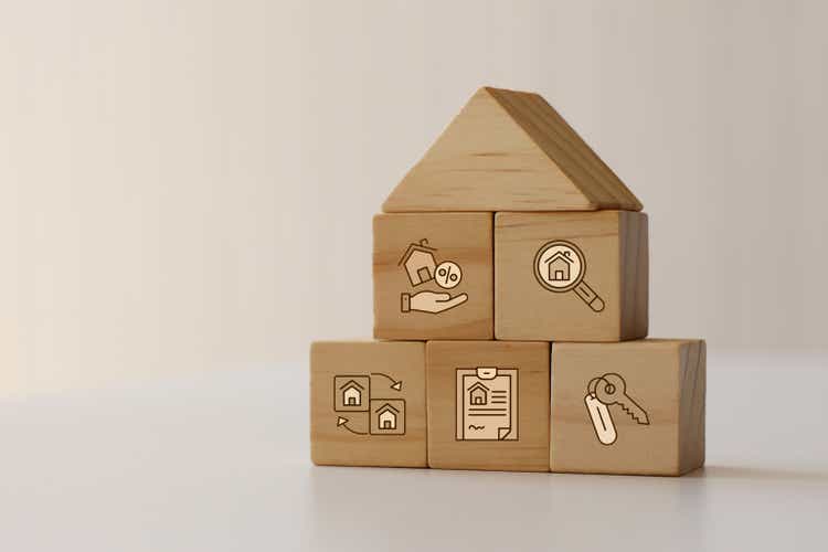 Real Estate icons on wooden blocks