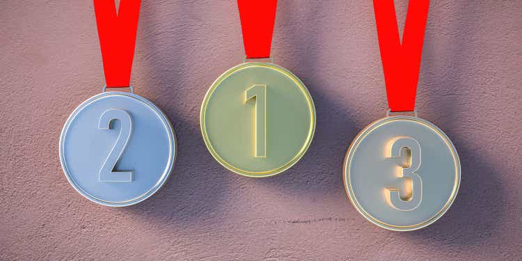 Winners medals set, golden, silver and bronze hanging on wall background. 3d illustration