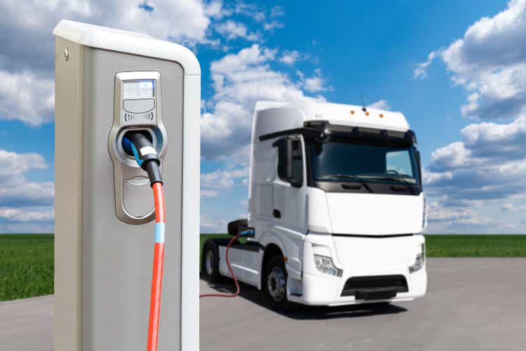 Electric vehicles charging station on a background of a truck