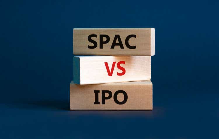 SPAC vs IPO symbol. Blocks with words "SPAC, special purpose acquisition company" and "IPO, initial public offering" on grey background, copy space. Business and SPAC vs IPO concept.