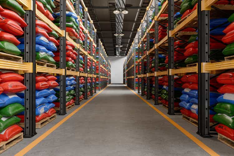 Mineral And Organic Fertilizer Bags On Wooden Pallets In The Warehouse