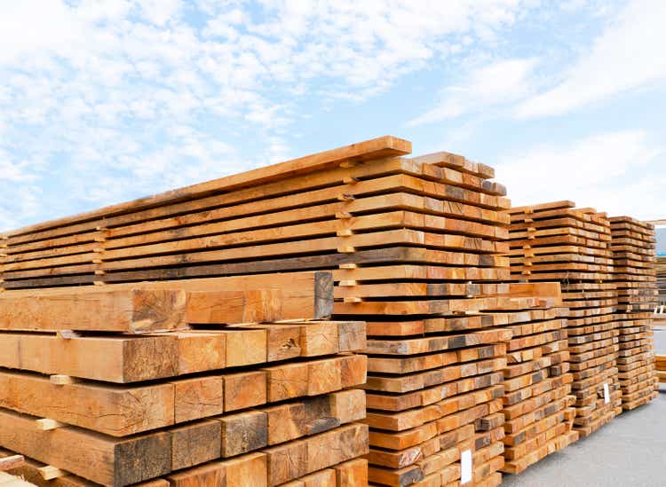 Stack of lumber and planks in a lumber warehouse outdoors