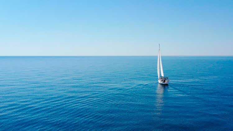 Aerial view of sailing luxury yacht at opened sea at sunny day in Croatia