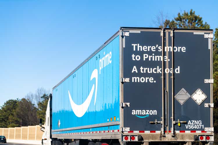 Highway road in Virginia with Amazon prime shipping delivery truck vehicle with blue Prime logo