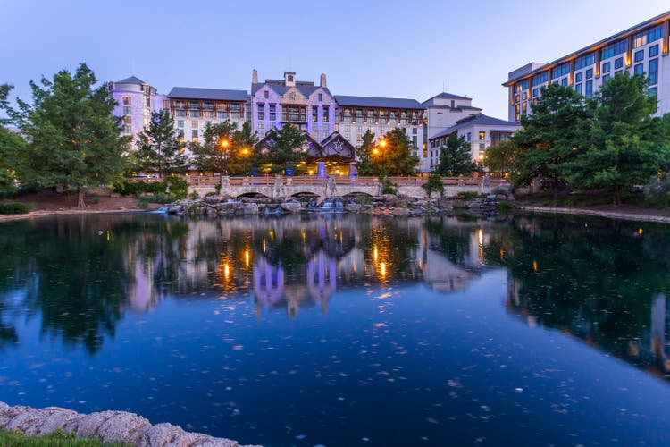 Beautiful Gaylord Texan Resort building over a stone bridge at twilight