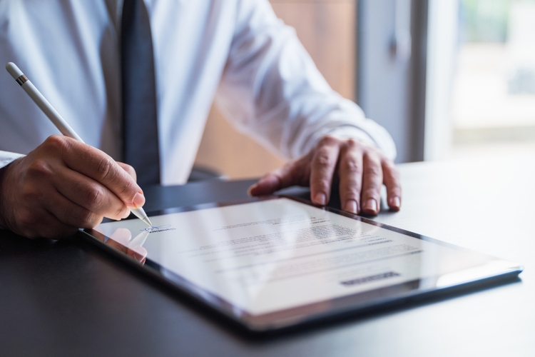 Man Signing The Digital Contract