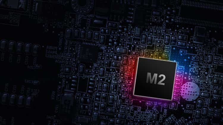 M2 processor chip. Network digital technology with computer cpu chip on dark motherboard background. Protect personal data and privacy from hacker cyberattack.