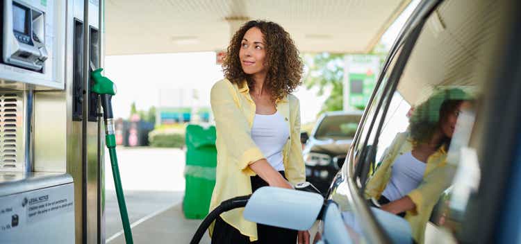 woman filling up at the petrol pump