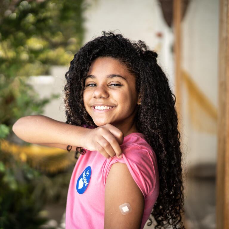Portrait of girl showing ar after vaccination