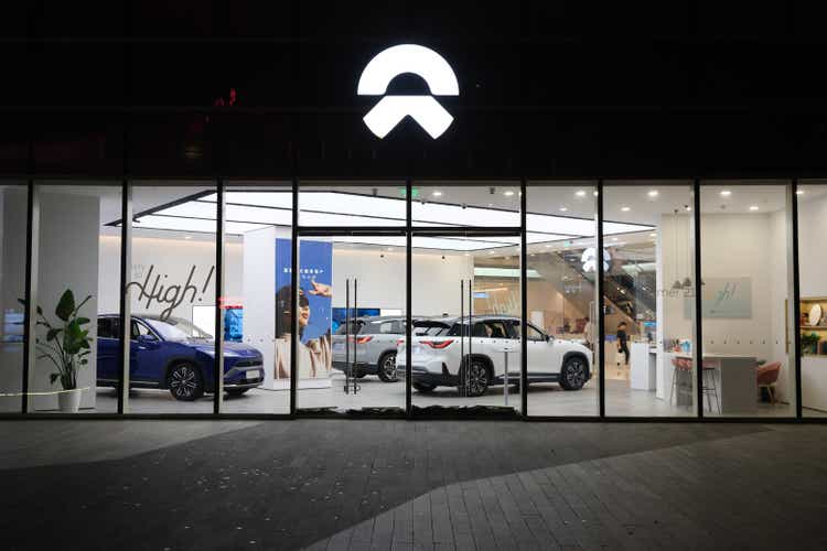 NIO electric car store at night. Chinese EV brand