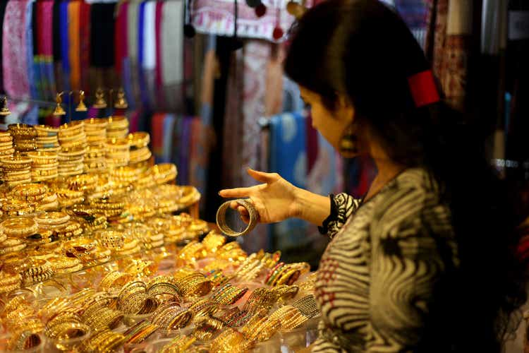 Women choosing jewelry from jewelry shop