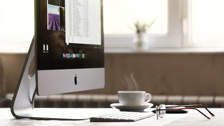 iMac computer and glasses on the table
