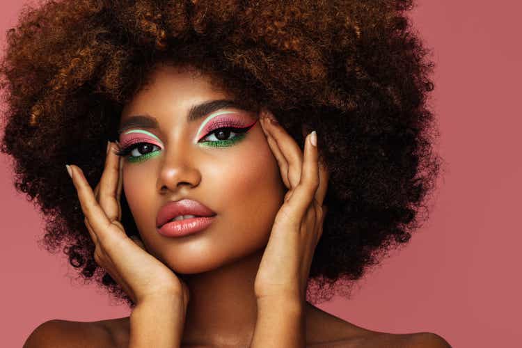 Portrait of young afro woman with bright make-up