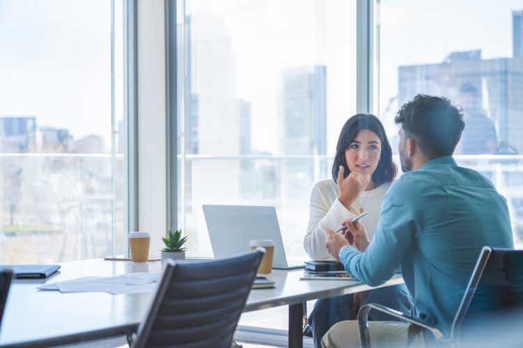 Business woman and man meeting and talking