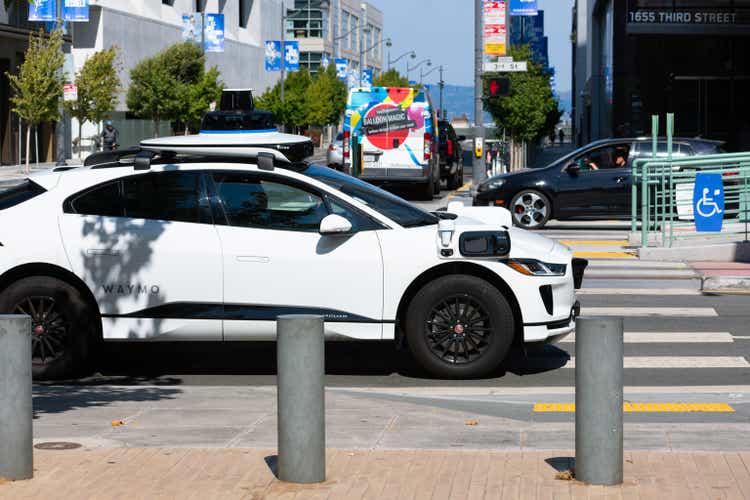 Waymo Jaguar I-Pace self driving car performing tests on urban street in San Francisco, California
