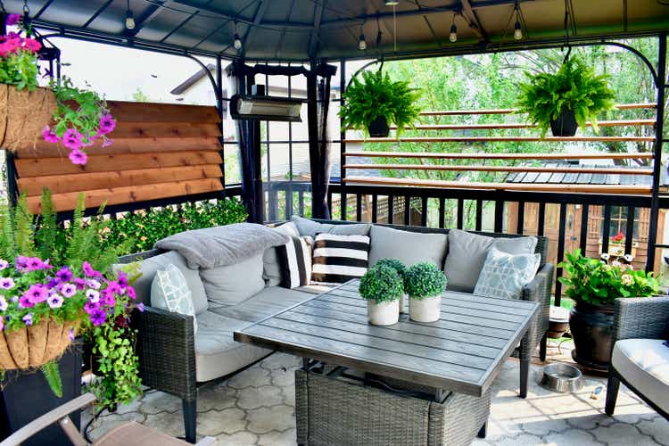 Outdoor backyard sheltered patio seating with a tropical Caribbean feel for summer relaxation