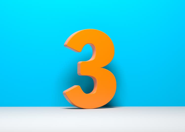 Orange-colored number three.