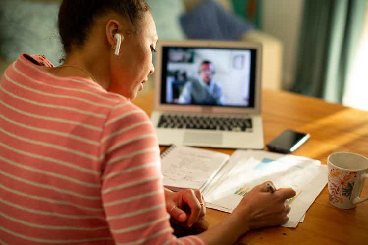 Black woman having a virtual meeting with her financial consultant