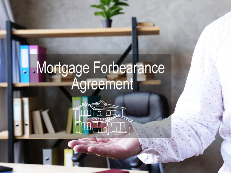 Mortgage forbearance agreement is shown on the business photo using the text
