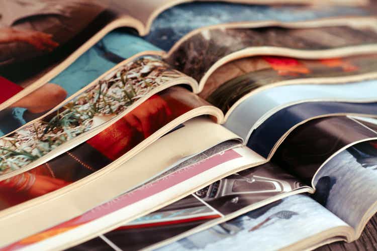 Stack of magazines .Closeup background of a pile of old magazines with bending pages