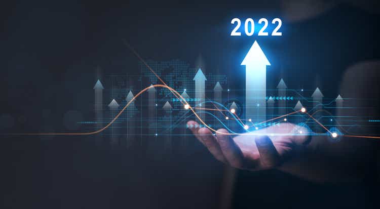 Businessman holding growth graph with year 2022. Corporate future growth plan in new year 2022.Development to success and growth business concept.