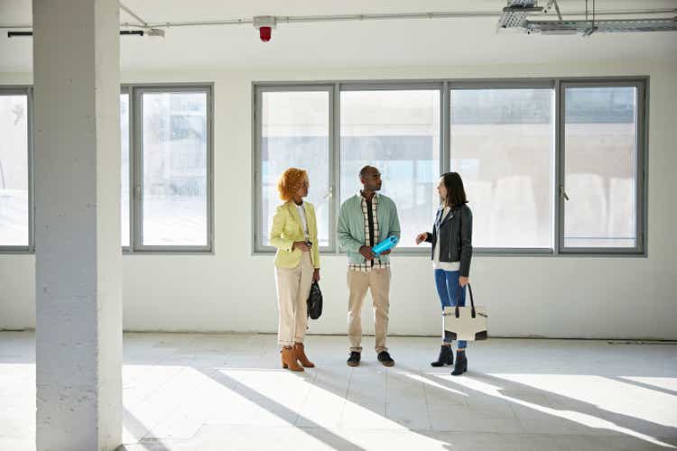 Businesswomen in 20s and 30s Discussing Property with Broker